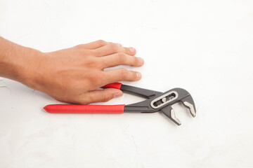 Pliers in hand and icholized on a white background. Home renovation tools.