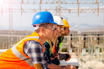 Group portrait of young workers in electric power station 