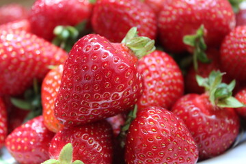 Juicy strawberries on a berries background