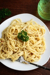 high angle view spaghetti with white cream sauce
