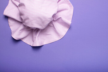 Tender pink hat for women, girls or baby on a trendy background. Stylish hat for the beach and travel.