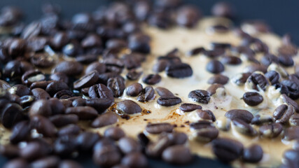 Background coffee beans with spiled coffee, close-up, selective focus