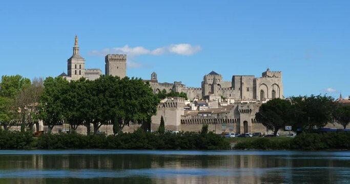 The Popes' Palace, Avignon, Vaucluse department, France. In the foreground is the river Rhone.