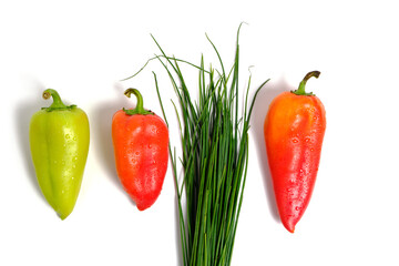Sweet bell peppers and green onions on a white background.