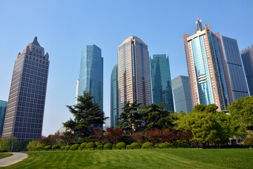 Obraz premium different colorful skyscrapers under blue sunny day in Lujiazui Park in Pudong of Shanghai 