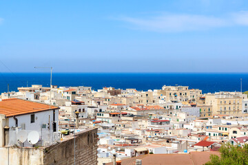 Panorama of Vieste town in Gargano, Puglia, South-East Italy. Sea is visible on the horizon. 