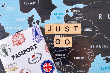 Passport with many stamps of different countries and just go slogan. Travel agency company advertising.