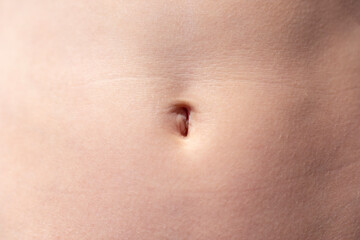 Navel of a teenage girl, front view close-up - obrazy, fototapety, plakaty