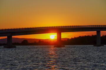 Fototapeta na wymiar Old bridge in Vir at sunset