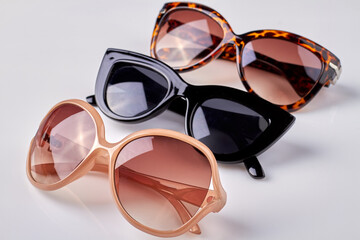 Collection of plastic female sunglasses. Isolated on white background.