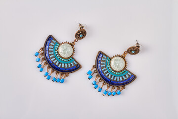 Beautiful decorative earrings. Isolated on white background.