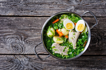 Ukrainian green sorrel soup top view, copy space