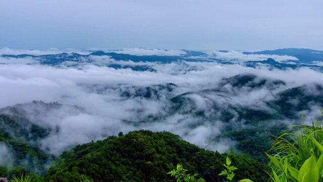 Time lapse video 4K, Morning mist over the mountain above Doi Pha sam Liam, Mae tang, Chiang mai, Thailand.