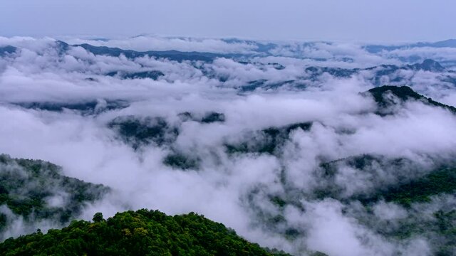 Time lapse video 4K, Morning mist over the mountain above Doi Pha sam Liam, Mae tang, Chiang mai, Thailand.
