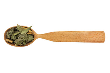 Dried Galega officinalis in a wooden spoon on a white background. Phytotherapy and disease prevention. Herbal collection for medicinal tinctures. Herbal tea in folk medicine. The view from the top