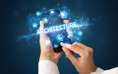 Female hand holding smartphone with ARCHITECTURE inscription, modern technology concept