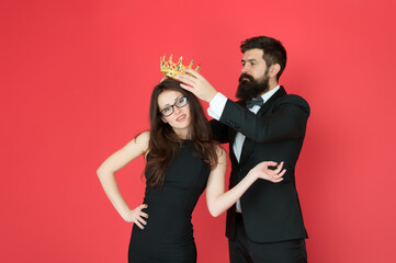Royal party. Prom couple in formal style. Prom party. Holiday celebration. Pride and glory. Luxury reward. Success symbol. Party night. Promotion and reward. Prom queen. Bearded man sexy girl