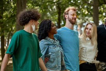 Naklejka premium beautiful tolerant mixed race young people gathered together to show that friendship has no race. african american and caucasian people make love, not war