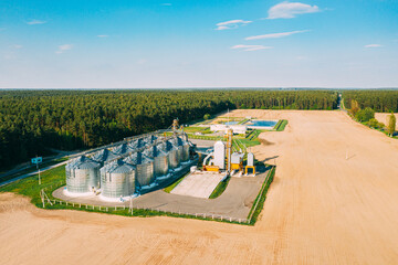 Aerial View Modern Granary, Grain-drying Complex, Commercial Grain Or Seed Silos In Sunny Spring...