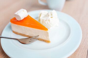 A piece of original cheesecake served with ice cream