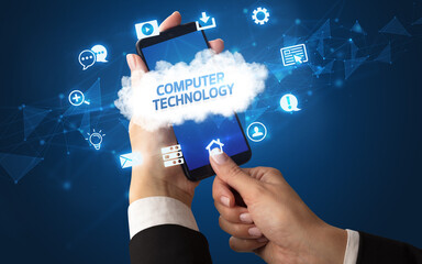 Female hand holding smartphone with COMPUTER TECHNOLOGY inscription, cloud technology concept