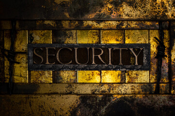 Security text formed with real authentic typeset letters on vintage textured silver grunge copper and gold background