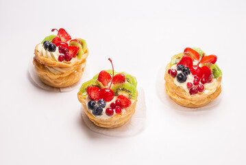 Home made cake with cream and fruits isolated.