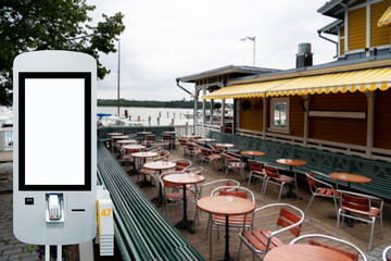 Self-service desk with touch screen on a street restaurant	