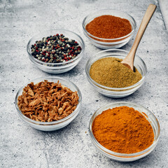 Spices and spices in glass saucers. Cooking and kitchen.