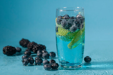 fresh summer drink with berries and lemon