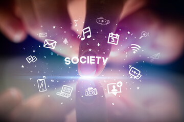Finger touching tablet with drawn social media icons and SOCIETY inscription, social networking concept