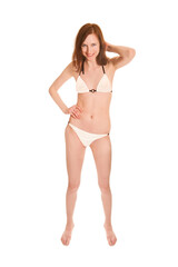 Fototapeta premium Full length portrait of a beautiful smiling woman wearing a white bikini, isolated on white studio background