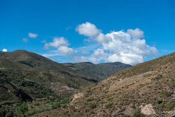 Fototapeta na wymiar mountainous area and sky with clouds