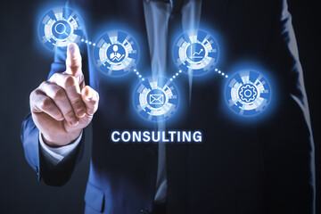 Consulting concept. Businessman pointing on dark background, closeup