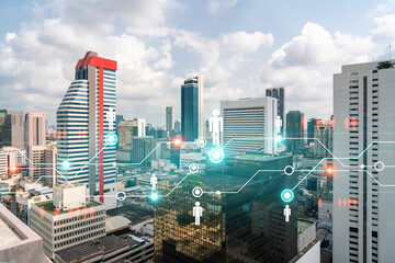 Social media icons hologram over panorama city view of Bangkok, Asia. The concept of people networking and connections. Double exposure.