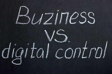 Chalkboard lettering "Buziness vs. digital control". Opinion on strengthening supervision