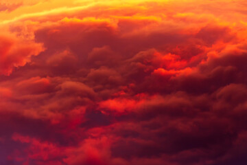 Red-yellow сumulus clouds on sunset