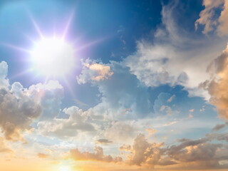sunset blue sky fluffy  white yellow pink clouds and sunlight beams skyline  nature landscape...
