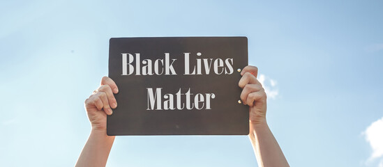 Black Lives Matter Protest Against Ending Racism Poster Over Human Rights Violation. The big hand...