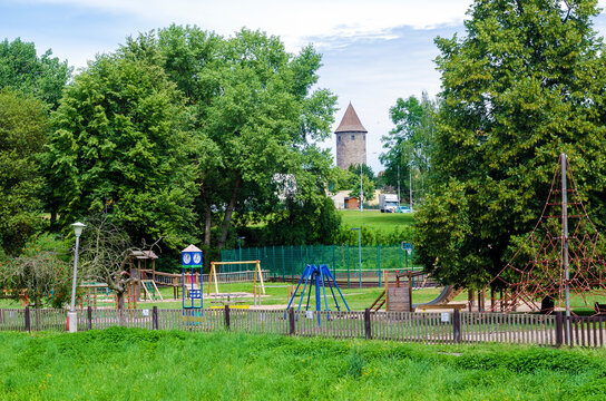 Colorful children playground in public park with green trees in Caslav, Czech Republic
