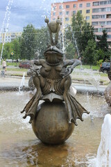 Fototapeta na wymiar A small fountain with a fairy-tale frog princess. Russia.