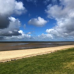 The Wadden Sea National Park, North Sea, Esbjerg, Denmark. Dyke, beach and marshland at low tide.