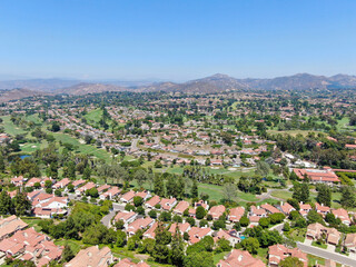 Aerial view of residential neighborhood surrounded by golf in green valley, Rancho Bernardo, San...