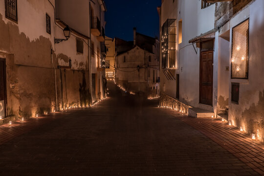 Titaguas village, streets illuminated by candles drawing shapes on the night of the candles celebration local july festival at Valencia Spain
