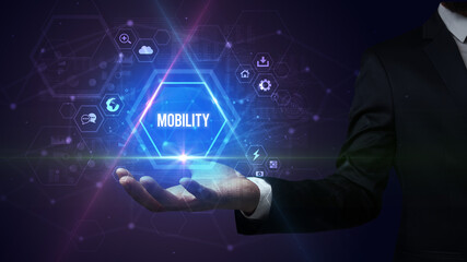 Man hand holding MOBILITY inscription, social media concept