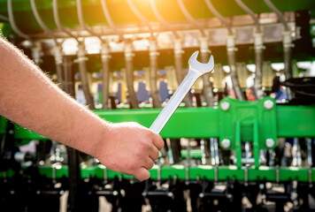 The mechanics repair combine harvester. Modern agricultural machinery