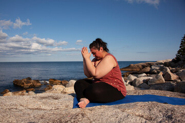 hands at third eye in yoga