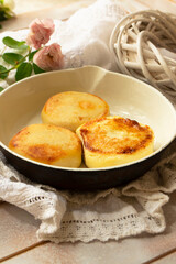 Delicious cottage cheese pancakes on rustic pan