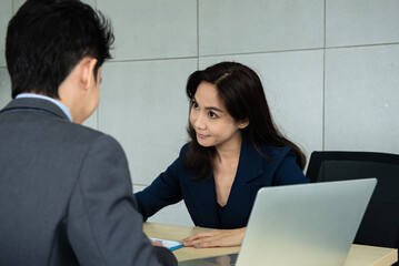 Obraz premium Young Asian people in job interview with resume.