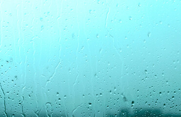 Raindrops on the window during a downpour. Water drops on the glass.